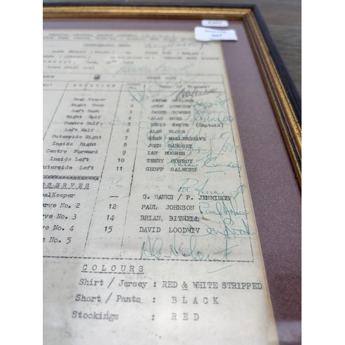 507 - A framed 1976 team sheet detailing a match between Stoke City and Slask Wroscow featuring the signat... 