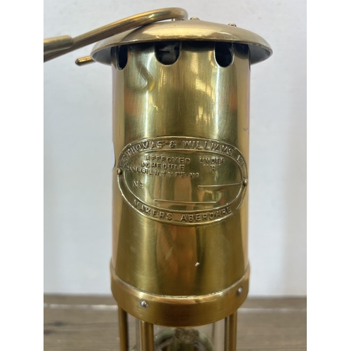 509 - An early 20th century E. Thomas & Williams Ltd brass miners lamp - approx. 25cm high