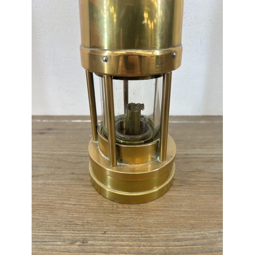 509 - An early 20th century E. Thomas & Williams Ltd brass miners lamp - approx. 25cm high