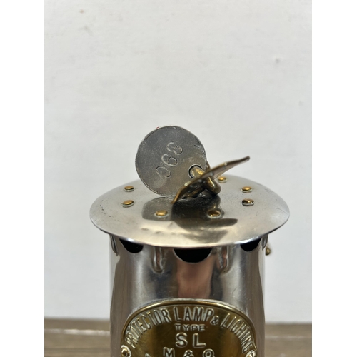 510 - An early 20th century Protector Lamp & Lighting Co Ltd type SL M&Q miners lamp - approx. 23cm high