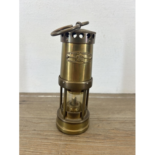 511 - A vintage E. Thomas & Williams Ltd miniature brass miners lamp - approx. 16cm high