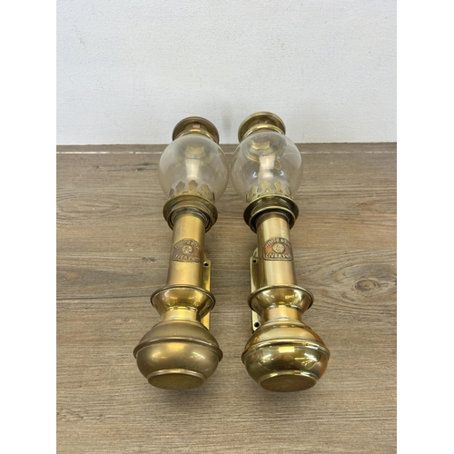 513 - A pair of 20th century brass carriage lamps with bulbous glass shades and copper plaques stating Whi... 