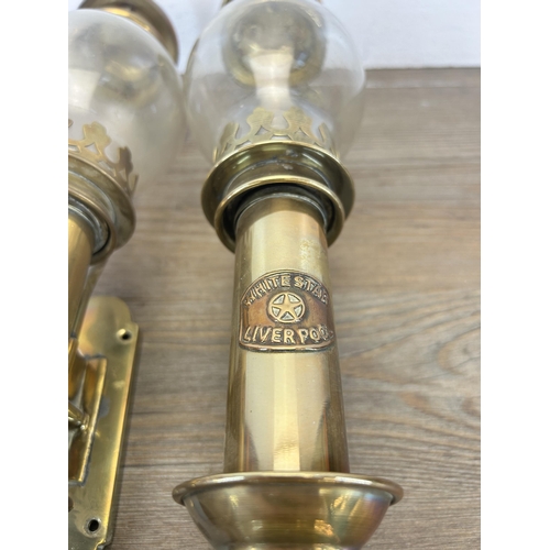 513 - A pair of 20th century brass carriage lamps with bulbous glass shades and copper plaques stating Whi... 