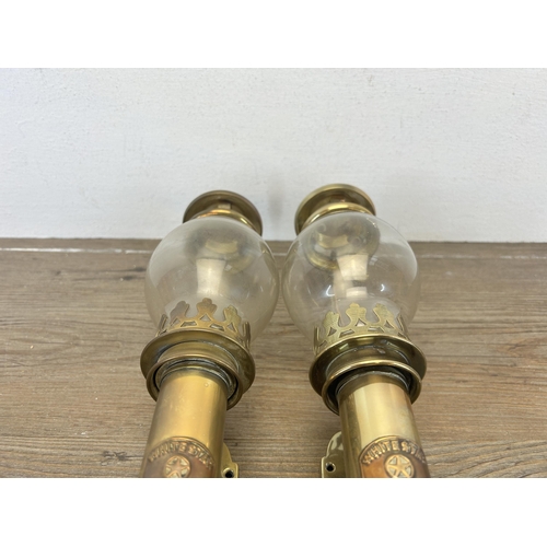 513 - A pair of 20th century brass carriage lamps with bulbous glass shades and copper plaques stating Whi... 