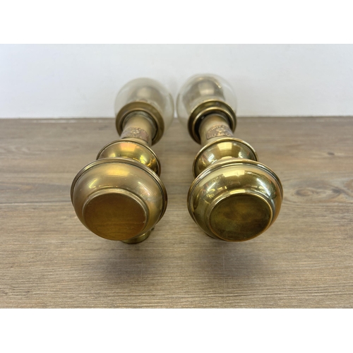 513 - A pair of 20th century brass carriage lamps with bulbous glass shades and copper plaques stating Whi... 