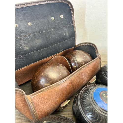 531 - A collection of vintage crown green bowls, one pair of leather cased and four Taylor-Rolph Co Ltd ty... 