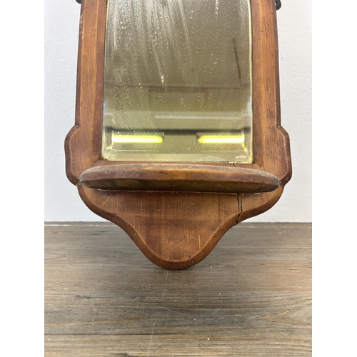 540 - A 19th century pine bevelled edge wall mirror with lower shelf - approx. 44cm high x 25cm wide