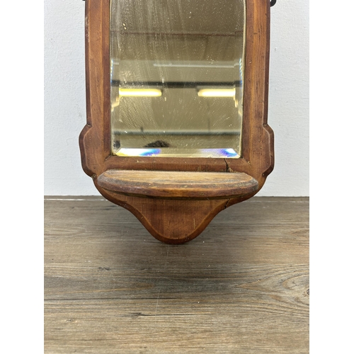 540 - A 19th century pine bevelled edge wall mirror with lower shelf - approx. 44cm high x 25cm wide