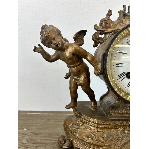 545 - A 19th century Japy Frères gilt chiming mantel clock with putti and repousse design - approx. 29cm h... 