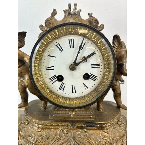 545 - A 19th century Japy Frères gilt chiming mantel clock with putti and repousse design - approx. 29cm h... 