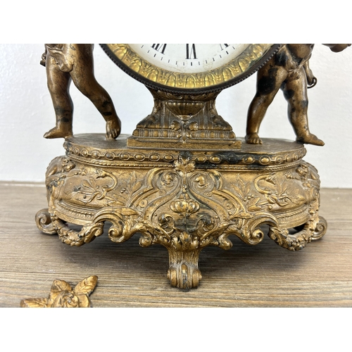 545 - A 19th century Japy Frères gilt chiming mantel clock with putti and repousse design - approx. 29cm h... 