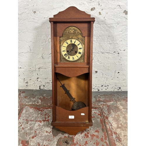 547 - A late 20th century mahogany cased chiming wall clock