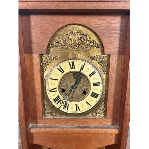 547 - A late 20th century mahogany cased chiming wall clock