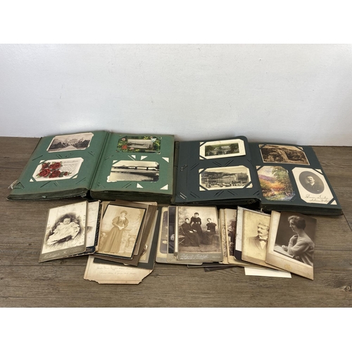 491 - A collection of Victorian and later photographs and postcards