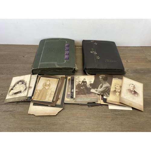 491 - A collection of Victorian and later photographs and postcards