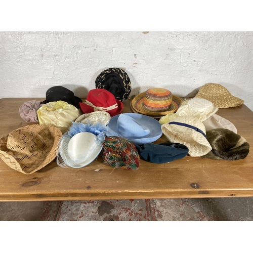 501 - A large collection of vintage hats to include early to mid 20th century black felt bowler hat, fur h... 