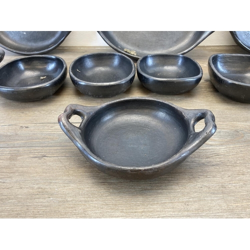 338 - A collection of Chamba black clay cookware