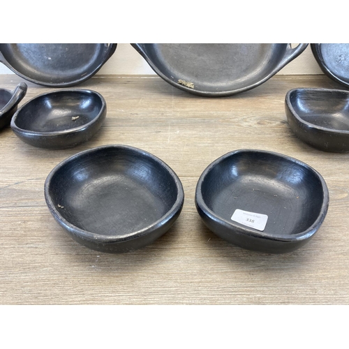 338 - A collection of Chamba black clay cookware