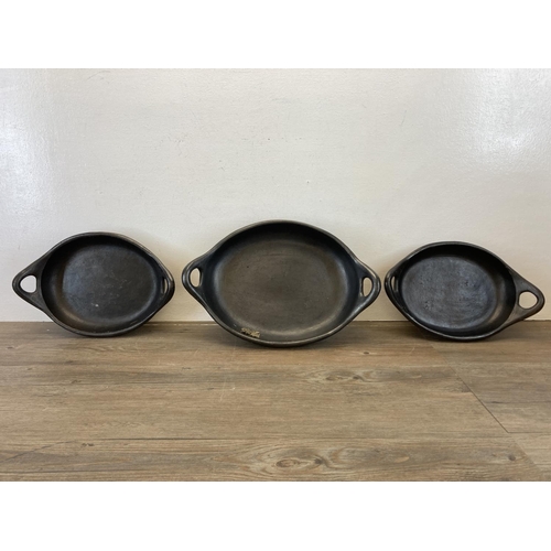 338 - A collection of Chamba black clay cookware