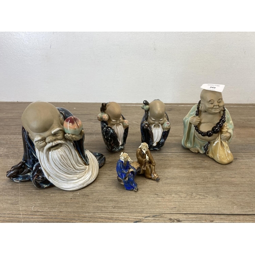 349 - A collection of Chinese porcelain figurines to include Mudmen etc.