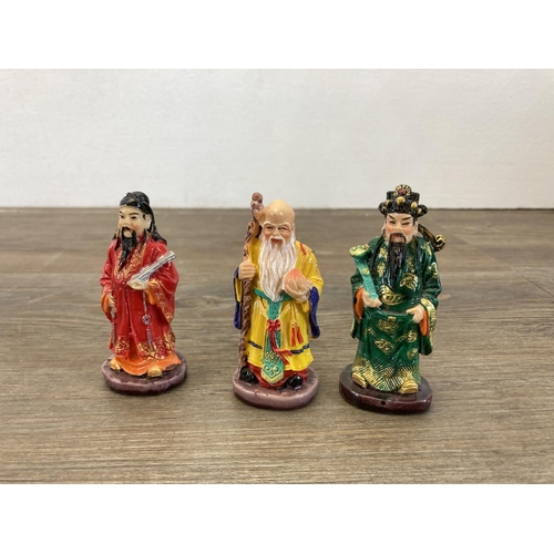 349 - A collection of Chinese porcelain figurines to include Mudmen etc.