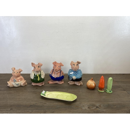 355 - Five ceramic items, four Wade NatWest pig money boxes and one Carlton Ware vegetable cruet set