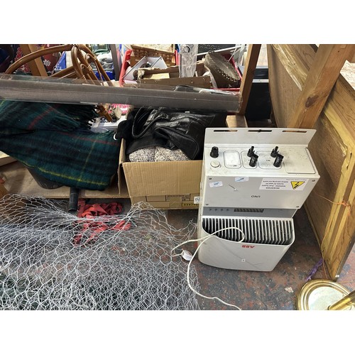 859 - A large collection of house clearance items to include handbags, Bosch hedge trimmer, chicken wire e... 