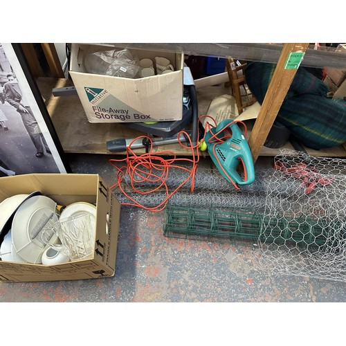 859 - A large collection of house clearance items to include handbags, Bosch hedge trimmer, chicken wire e... 