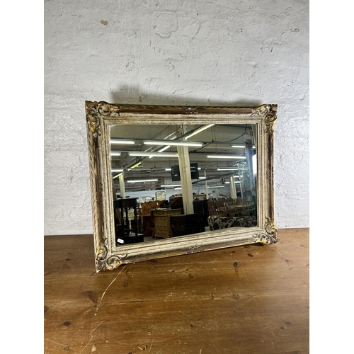 232 - A French Louis XVI style white and gilt framed wall mirror - approx. 70cm high x 90cm wide