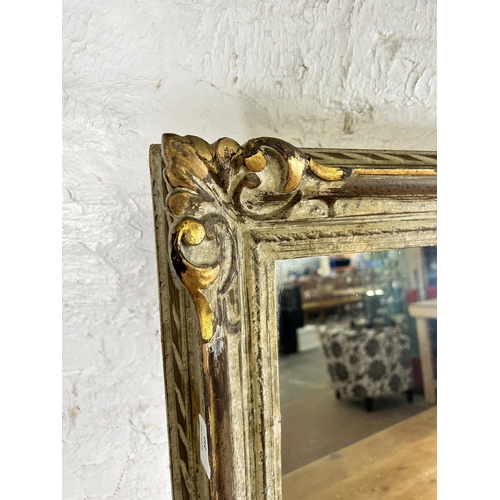 232 - A French Louis XVI style white and gilt framed wall mirror - approx. 70cm high x 90cm wide