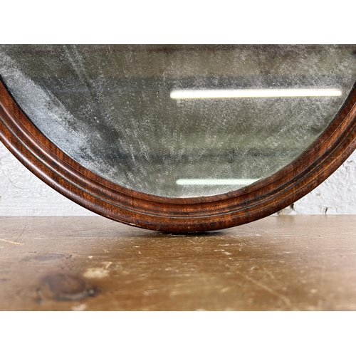 238 - A late 19th century carved mahogany framed oval wall mirror - approx. 92cm high x 55cm wide