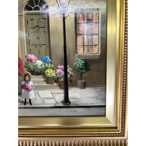 239A - A gilt framed Deborah Jones (1921-2012) oil on board of a 19th century shop front scene - approx. 45... 