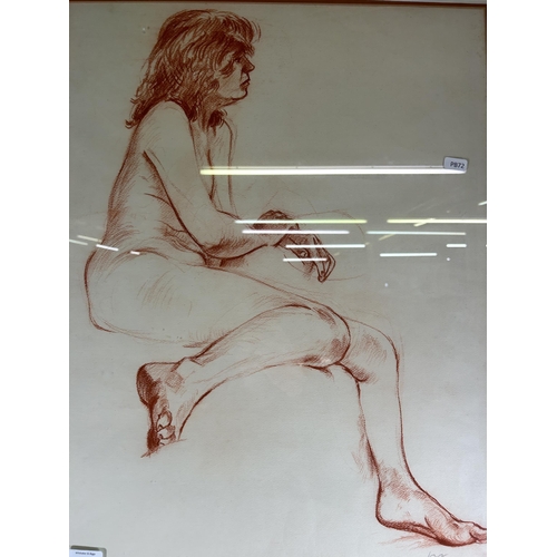 240 - A late 20th century framed red pastel portrait of a nude female signed Carl and dated 1988 - approx.... 