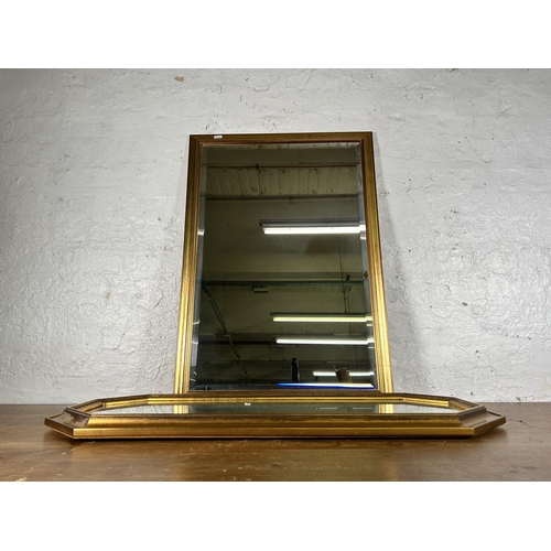 243 - Two gilt framed wall mirrors - largest approx. 84cm high x 58cm wide