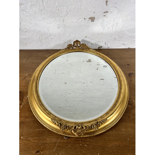 266 - A 19th century style gilt framed bevelled edge oval wall mirror - approx. 67cm high x 54cm wide