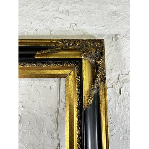 270 - A 19th century style black and gilt picture frame - approx. 79cm high x 110 wide