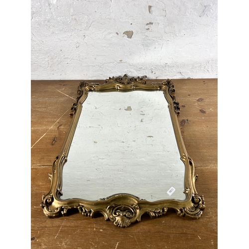 275 - A Rococo style gilt framed wall mirror - approx. 72cm high x 44cm wide