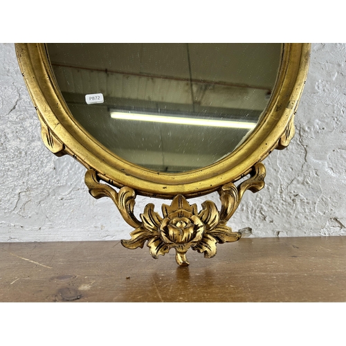 276 - A Rococo style gilt framed oval wall mirror - approx. 100cm high x 50cm wide