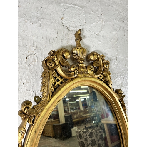 276 - A Rococo style gilt framed oval wall mirror - approx. 100cm high x 50cm wide