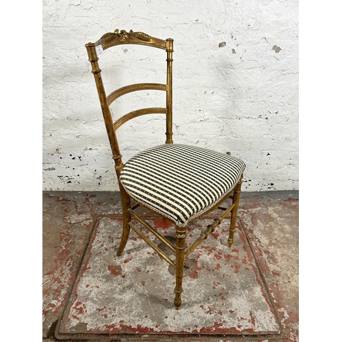 130 - A 19th century French gilt wood occasional chair with later added upholstery