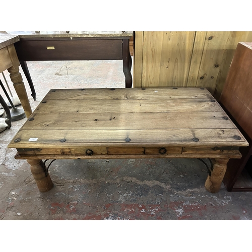 156 - An Indian sheesham wood and metal banded two drawer coffee table - approx. 40cm high x 60cm wide x 1... 