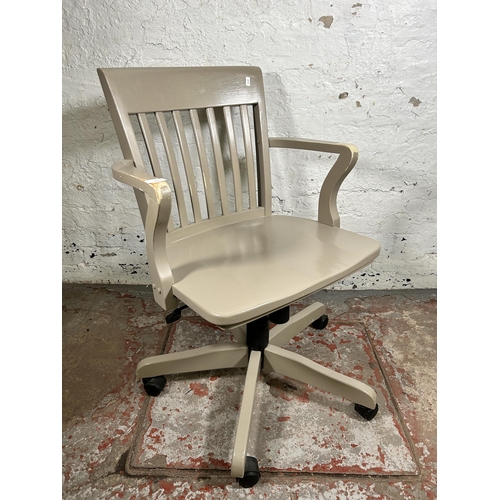 160 - A modern grey painted swivel desk chair