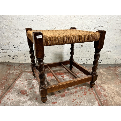 168 - A mid 20th century carved oak and woven barley twist stool - approx. 48cm high x 47cm wide x 40cm de... 