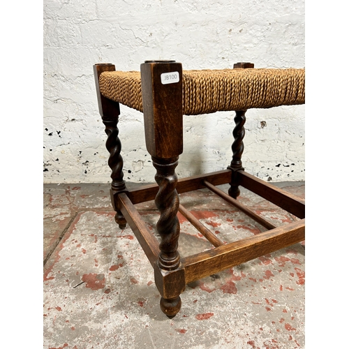 168 - A mid 20th century carved oak and woven barley twist stool - approx. 48cm high x 47cm wide x 40cm de... 