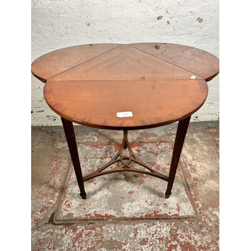 174 - An Edwardian style mahogany three leaf folding side table - approx. 71cm high x 77cm in diameter