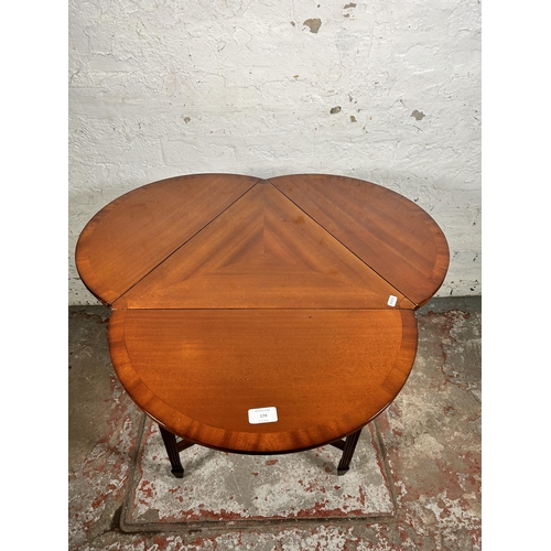 174 - An Edwardian style mahogany three leaf folding side table - approx. 71cm high x 77cm in diameter