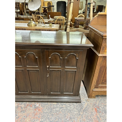 175 - A mid/late 20th century oak three door sideboard with fitted interior - approx. 86cm high x 140cm wi... 