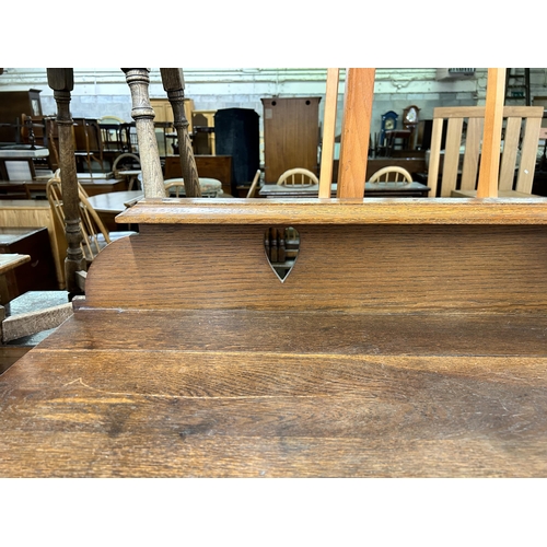 177 - An Arts & Crafts carved oak sideboard - approx. 110cm high x 137cm wide x 51cm deep