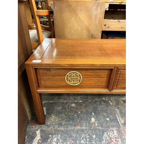 179 - A Chinese hardwood three drawer coffee table - approx. 46cm high x 46cm wide x 123cm long