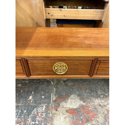 179 - A Chinese hardwood three drawer coffee table - approx. 46cm high x 46cm wide x 123cm long